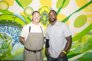 Chicago Bears cornerback Charles “Peanut” Tillman and “MasterChef” judge Graham Elliot celebrate art and Chicago culture at the preview of the Sierra Mist® Exquisite Collaboration Billboard Project on September 17, 2014 in Chicago, Illinois. The billboard – a collaborative effort between five local Chicago artists – will be photographed and placed in 15 locations throughout the city in late September.