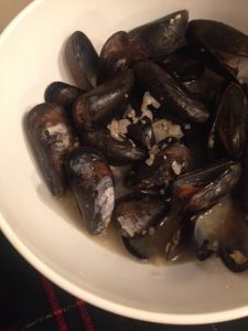 Live mussels cooked in buttery broth